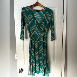 Mock wrap dress, with a funky geometric print. Only worn once.